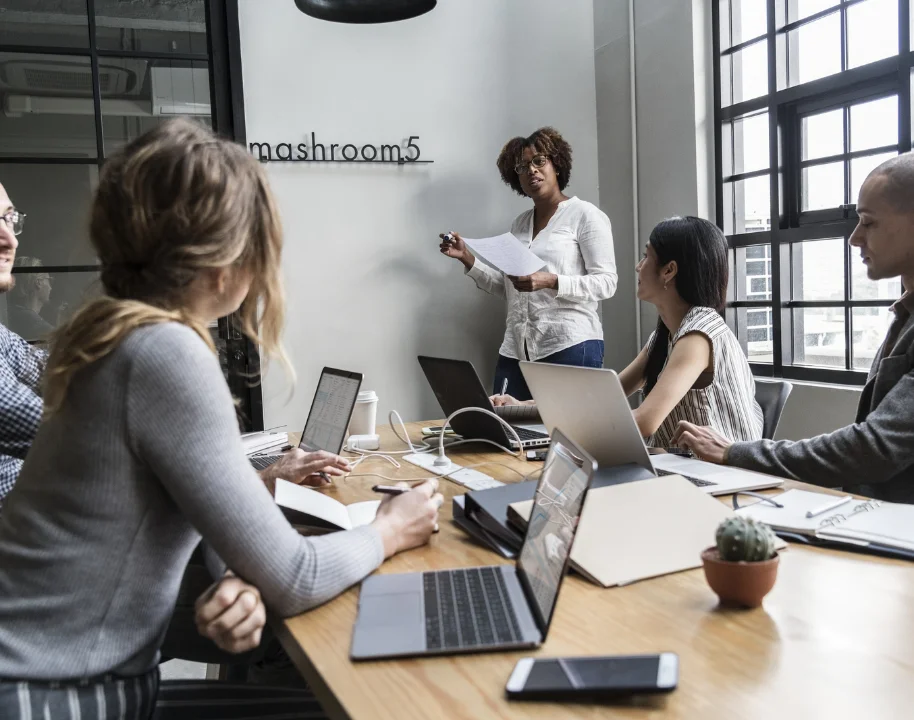 Man and woman working looking at a desk